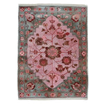 Elegant Blush Medallion Knotted Wool Area Rug featuring intricate floral patterns in shades of pink and soft gray, highlighting a sophisticated central medallion design.