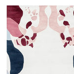 Close-up view of the Blush Mirage Bloom Hand Tufted Rug, showcasing its contemporary abstract design in rich burgundy, blush, and deep navy hues. This elegant wool rug is perfect for adding a modern touch to any living room. Ideal as an area rug, specifically in an 8x10 size, it combines style with comfort.