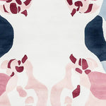 Close-up view of the Blush Mirage Bloom Hand Tufted Area Rug, showcasing its contemporary design with abstract floral patterns in pink and burgundy shades against a soft white background. Ideal for adding an artistic touch to living room rugs 8x10, this wool rug combines elegance and modern style.