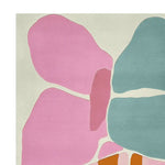 A contemporary area rug with a unique abstract design featuring large, colorful shapes in shades of pink, blue, and orange. Perfect for a modern living room, this 8x10 hand-tufted wool rug adds a splash of color and style to any space.