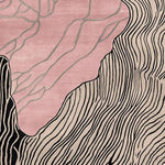 This contemporary area rug, titled 'Blush Terrain Canvas Hand Tufted Rug', showcases an artistic design with flowing abstract lines in black and beige against a blush pink background. Perfect as a wool rug for modern living rooms, it adds a stylish touch to any space.