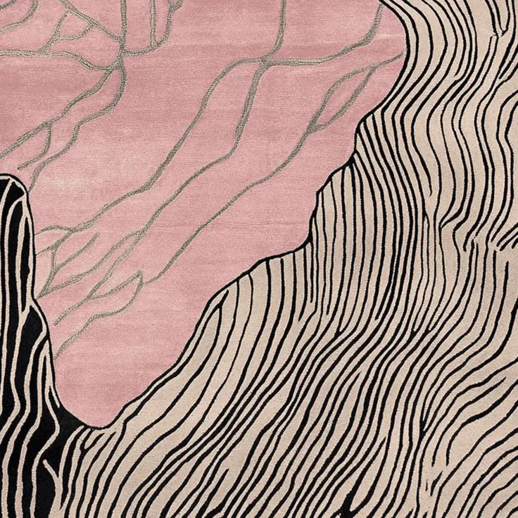 This contemporary area rug, titled 'Blush Terrain Canvas Hand Tufted Rug', showcases an artistic design with flowing abstract lines in black and beige against a blush pink background. Perfect as a wool rug for modern living rooms, it adds a stylish touch to any space.