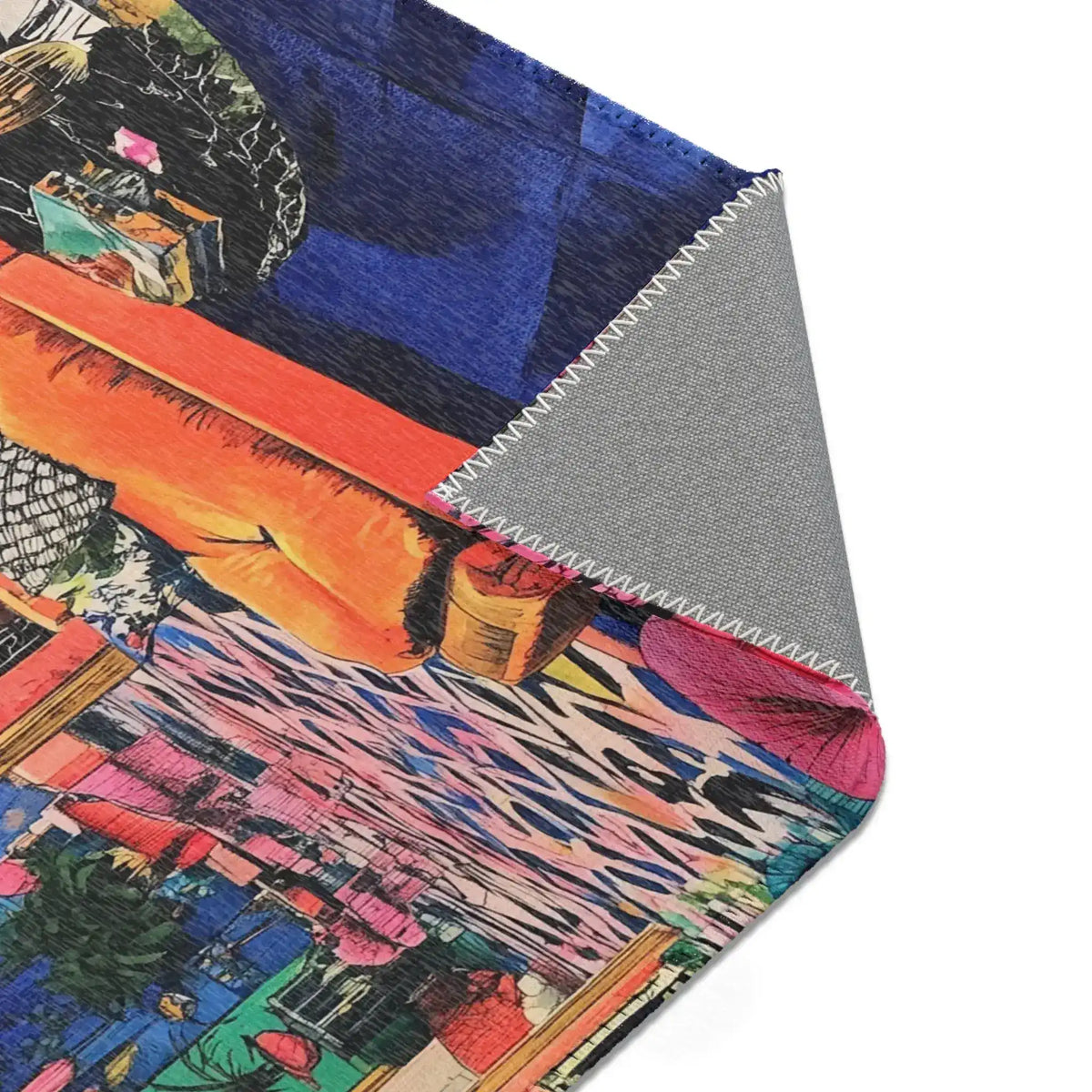 Corner fold of Bold Blue Elegance Luxe Maximalist Rug showing printed face with cobalt blue and grey non-slip stitched backing