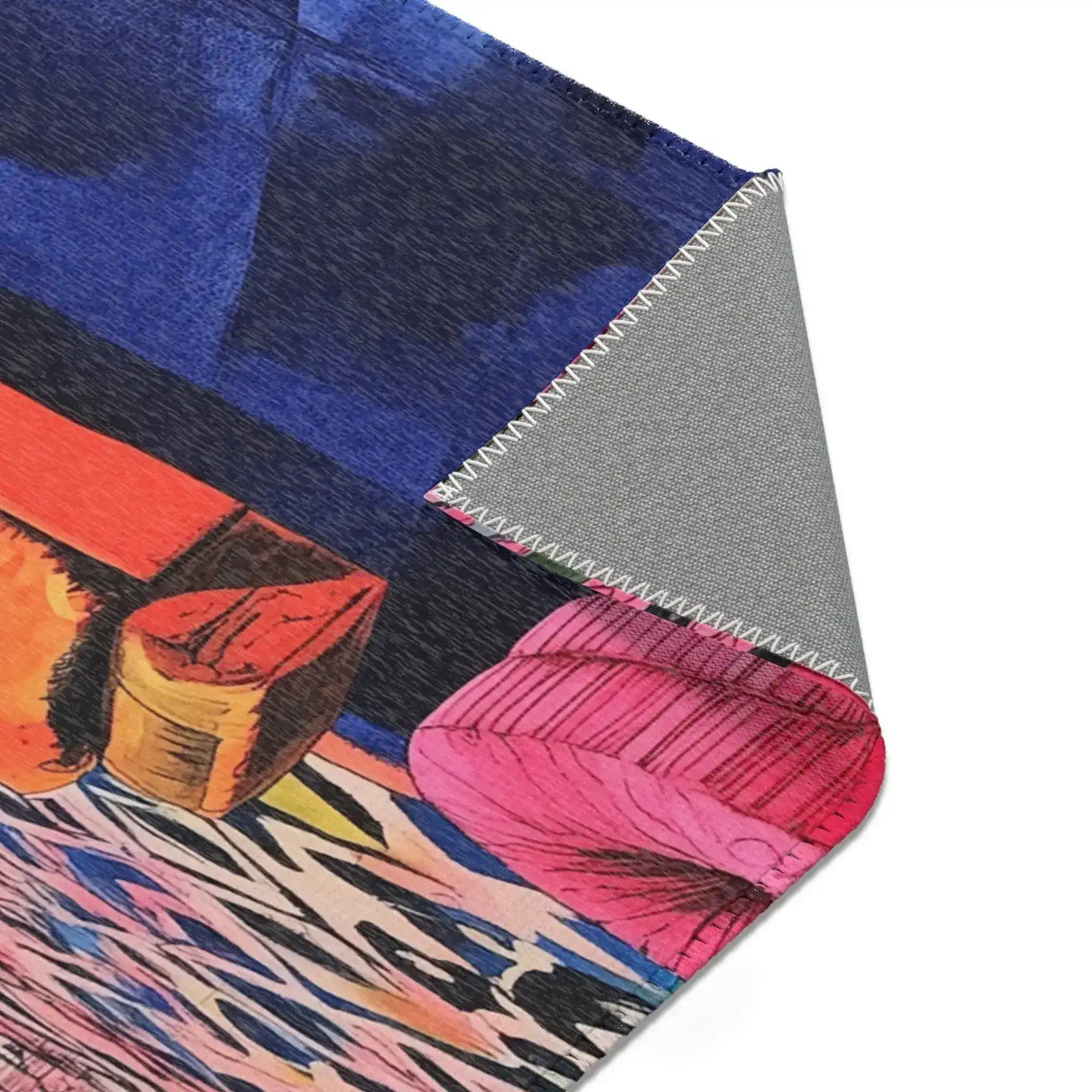 Triangular folded corner of Bold Blue Elegance Luxe Maximalist Rug showing cobalt blue print and grey anti-slip zigzag-stitched backing