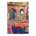 Wide view of Bold Blue Elegance Luxe Maximalist Rug in opulent salmon pink room with crystal chandelier tropical plants and arched doorway