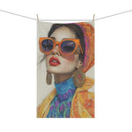 Bold Elegance Fashionista Art cotton kitchen towel on clothesline — full view of vibrant fashion woman print with orange sunglasses and yellow coat