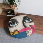 Bold Floral Portrait Floor Pillow single pillow from above in room near wooden shelf and plant, blue eyes face design