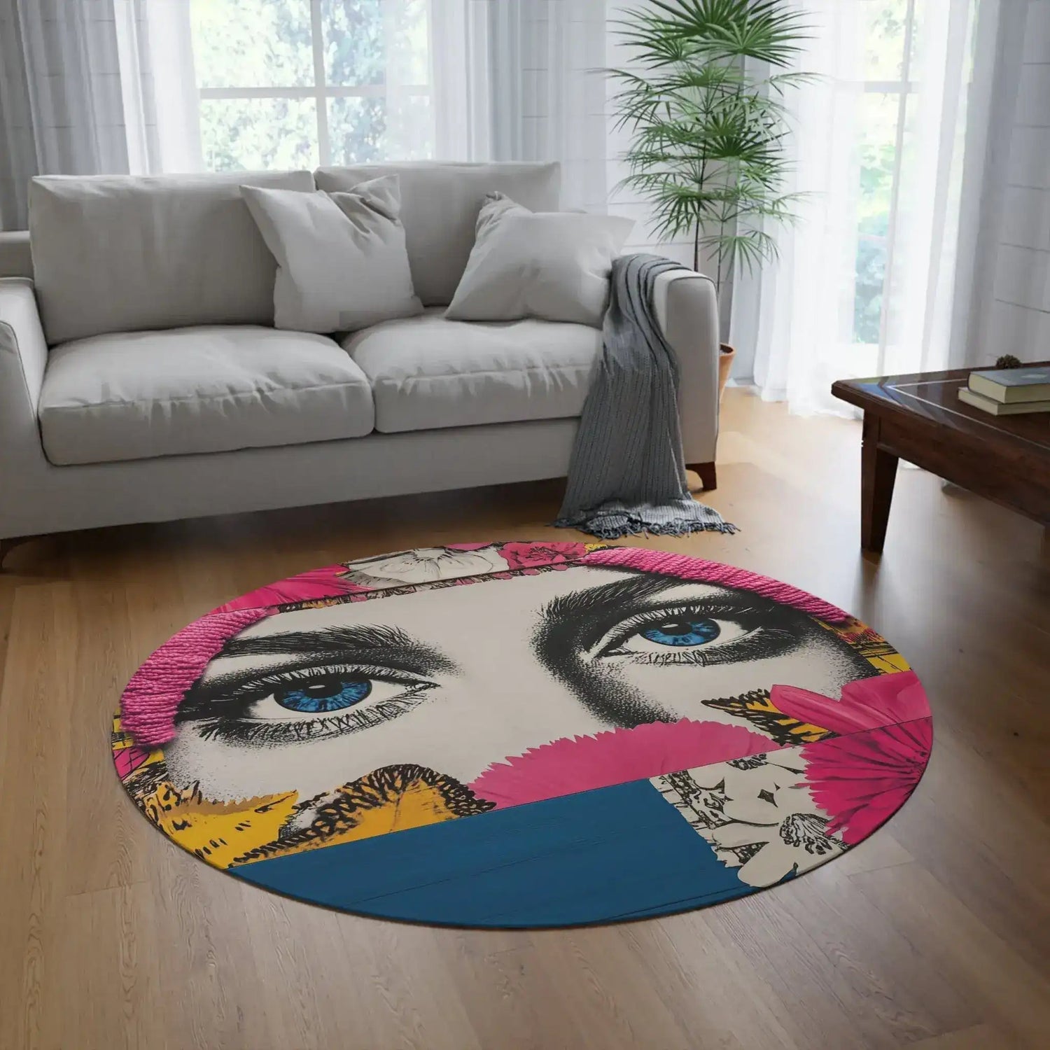 Bold Floral Portrait Round Rug styled in a living room on wood floor with gray sofa, pop-art blue eyes collage design