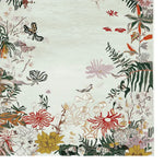 A beautifully detailed Botanic Dream Reverie Hand Tufted Area Rug, perfect for large living rooms. This wool rug features an intricate design of colorful flowers and leaves, providing a vibrant and elegant touch to any living room area.