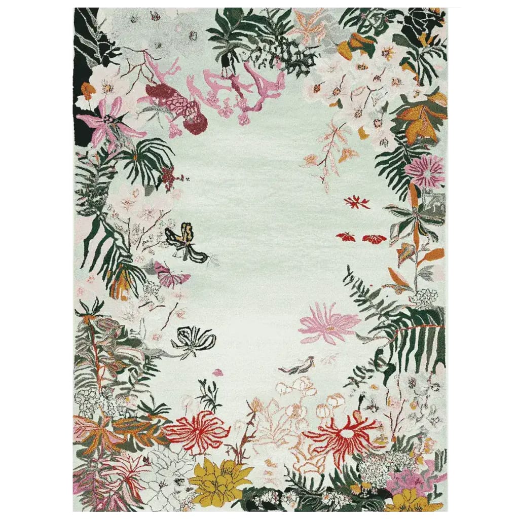 The Botanic Dream Reverie Hand Tufted Rug showcases a vibrant botanical design with various colorful flowers and leaves on a soft, muted background. This area rug is perfect for enhancing any living room space, offering a blend of style and comfort typical of large living room rugs. Crafted from high-quality wool, it brings an elegant and natural touch to your decor.
