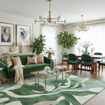 Modern living room with green sofa, patterned rug, and decorative plants.