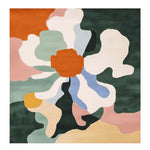 This hand-tufted wool area rug features a bold, abstract floral design with colors like orange, green, and blue, ideal for contemporary living rooms. Perfect as a square area rug, it adds a modern touch to any space, making it a standout piece among rugs for living room settings.