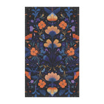 Botanical Bliss Floral Design Cotton Kitchen Towel flat lay, dark navy ground with mirrored orange and blue botanical florals and foliage