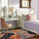 A vibrant Botanical Bliss Hand Tufted Area Rug featuring a floral design in bold colors, perfect for adding a touch of nature to your living room. This wool rug complements a cozy bedroom setting with a soft color palette, offering an inviting feel to area rugs for living room spaces.