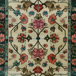 A beautifully detailed Botanical Bliss Medium Hand Knotted Wool Rug showcasing intricate floral patterns in vibrant colors, perfect for enhancing dining room aesthetics. This vintage Persian rug, ideal for living rooms, features traditional designs that bring warmth and elegance to any space.