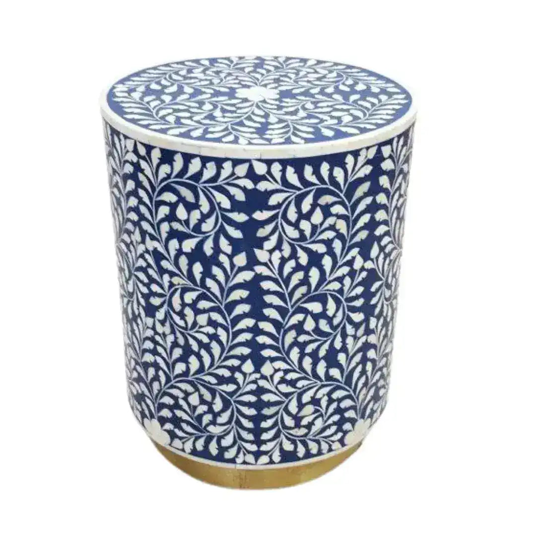 Botanical Blue Bone Inlay coffee table — cylindrical drum shape, navy ground with white leaf-vine inlay, gold base