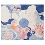 A vibrant, hand-tufted area rug featuring an abstract floral design in soft pink, blue, and white tones. This contemporary rug adds a touch of elegance to any living room, crafted from high-quality wool for durability and comfort.