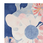 Close-up view of the Botanical Dream Tapestry Hand Tufted Area Rug, showcasing its vibrant abstract floral design. This contemporary rug features a harmonious blend of blues, pinks, and creams, perfect for adding a touch of elegance to area rugs for living rooms. Made from high-quality wool, this rug combines durability with artistic flair, making it an ideal choice for modern interiors.