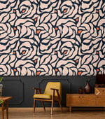 Botanical extravaganza wallpaper above dark navy paneling; retro yellow armchair and mid-century teak sideboard below