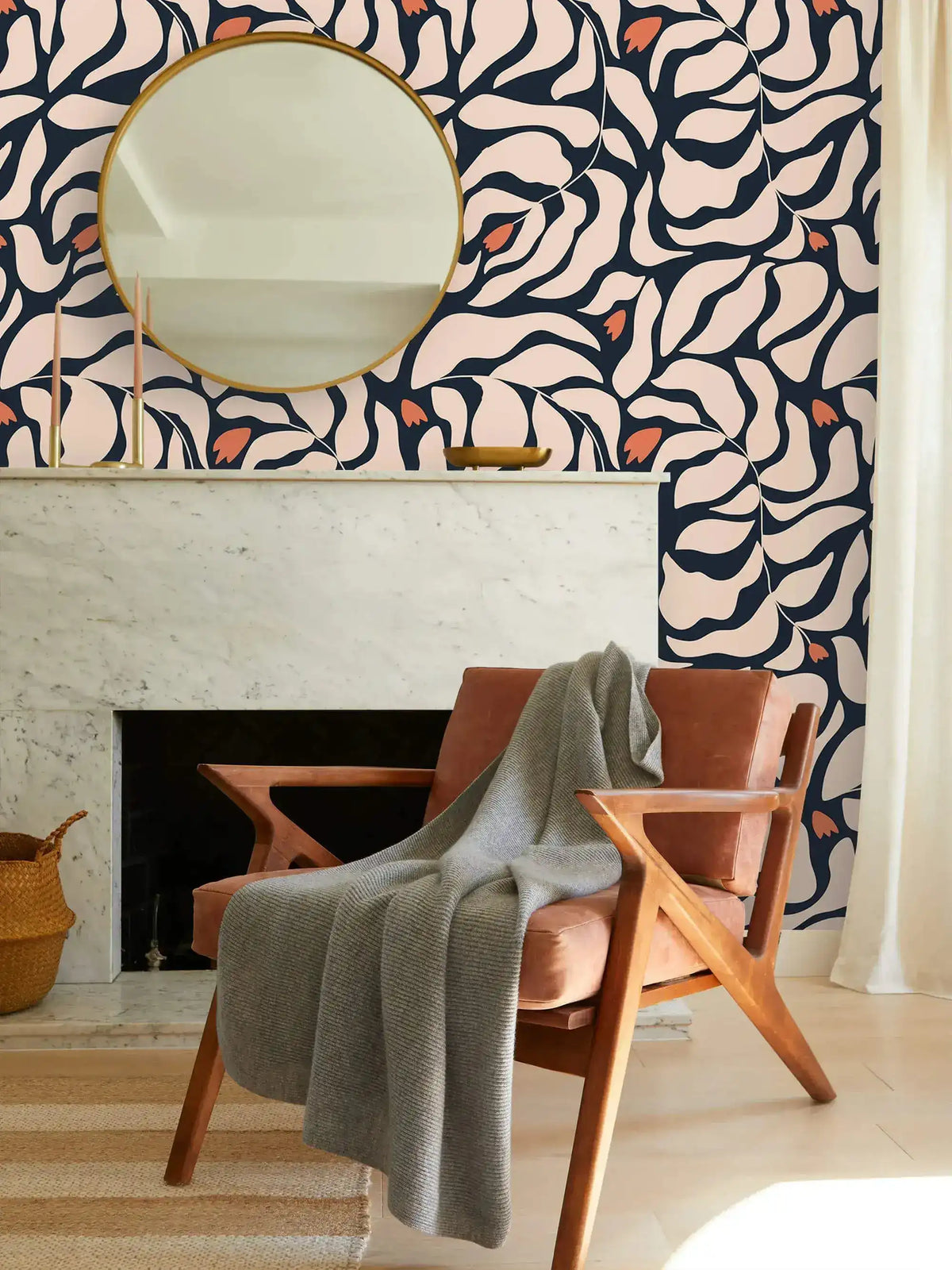 Botanical extravaganza wallpaper: bold cream and navy abstract oversized leaves with orange blooms over marble fireplace