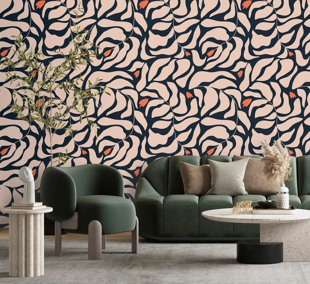 Botanical extravaganza wallpaper with cream navy oversized swirling leaves and orange buds; green bouclé sofa in living room