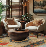 Elegant living room featuring a Botanical Grace Wool Hand Knotted Area Rug with a vintage floral design. This large 8x10 Persian-style rug adds a touch of sophistication to the space, complementing the cozy armchairs and round wooden coffee table.