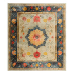 Elegant Botanical Grace Wool Hand Knotted Area Rug featuring vibrant floral patterns with intricate detailing against a rich blue and beige background, showcasing exquisite craftsmanship.