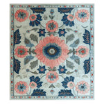Top view of the Botanical Rhapsody Dream Hand Tufted Area Rug, showcasing a vibrant floral design with pink, blue, and green hues. This wool rug is perfect for adding a touch of elegance to any living room, making it an ideal choice for those seeking a stylish floral rug.