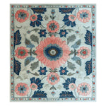 Top view of the Botanical Rhapsody Dream Hand Tufted Area Rug, showcasing a vibrant floral design with pink, blue, and green hues. This wool rug is perfect for adding a touch of elegance to any living room, making it an ideal choice for those seeking a stylish floral rug.