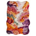 Vibrant Bouquet Nouveau hand-tufted wool area rug featuring an abstract floral design with rich hues of purple, orange, and pink. The intricate pattern creates a warm and inviting atmosphere, perfect for enhancing any living space.