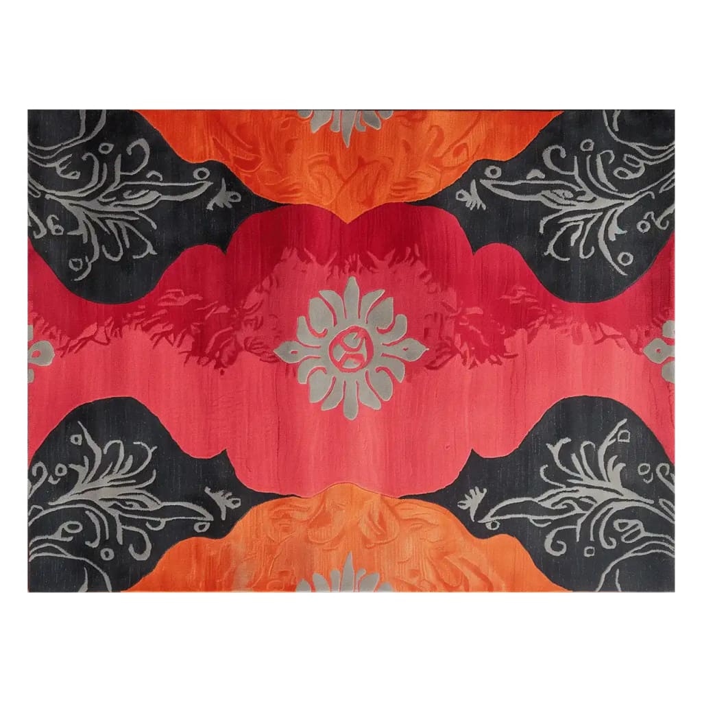 A vibrant Brazen Elegance hand-tufted wool area rug featuring bold red, orange, and black abstract patterns with floral motifs, adding a touch of luxury to any room.