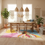 Dining room with a colorful rug, wooden table, and chairs.