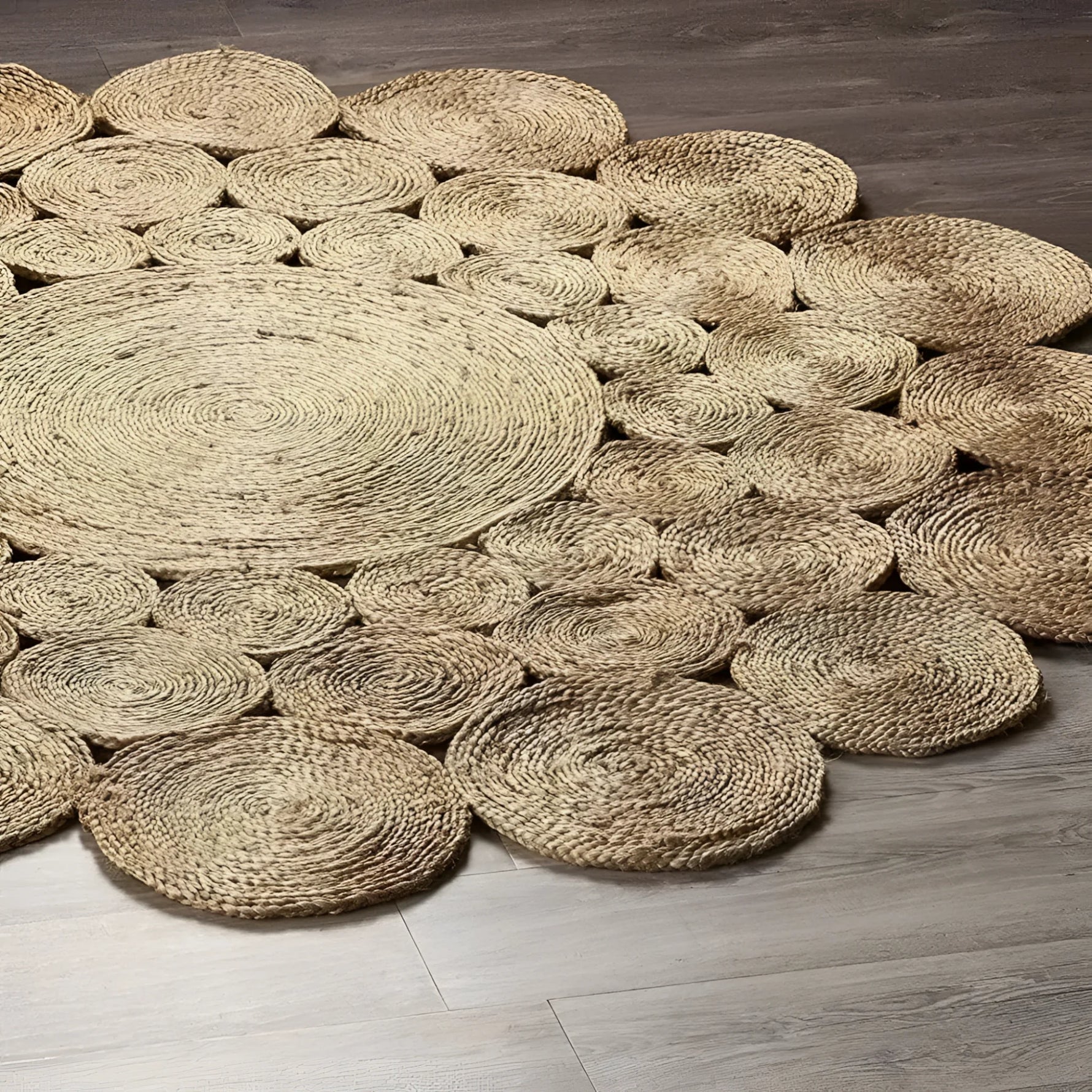 A beautifully crafted Bria Natural Jute Round Area Rug, perfect for adding a rustic touch to any dining room or living space. This large area rug features a unique woven pattern, ideal as a dining table rug or a centerpiece in large area rugs for the living room. The natural jute material enhances its durability and style, making it an excellent choice for a round rug in any home setting.