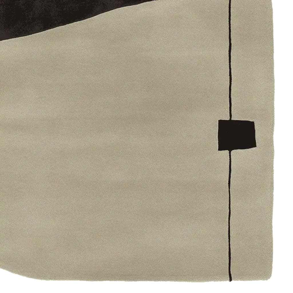 Close-up view of a contemporary wool area rug featuring a minimalist design with a beige background and abstract black lines, perfect for enhancing living room decor.