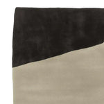 Top view of a Brutalist Sand Field Hand Tufted Area Rug, featuring a modern, abstract design with contrasting black and beige tones. Perfect for adding a contemporary touch to living room area rugs, this wool rug combines style and comfort, ideal for area rugs for living room settings.