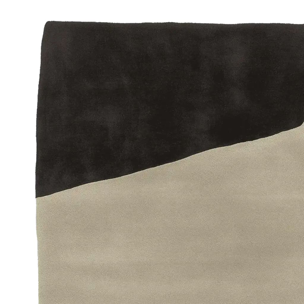 Top view of a Brutalist Sand Field Hand Tufted Area Rug, featuring a modern, abstract design with contrasting black and beige tones. Perfect for adding a contemporary touch to living room area rugs, this wool rug combines style and comfort, ideal for area rugs for living room settings.