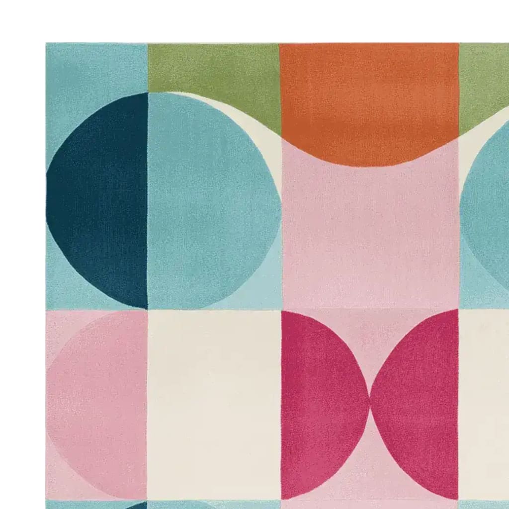 A vibrant and contemporary area rug featuring a bold geometric pattern with circles and squares in shades of blue, pink, green, and orange. This hand-tufted wool rug is perfect for adding a pop of color to any living room. Ideal for those seeking unique living room rugs 8x10.