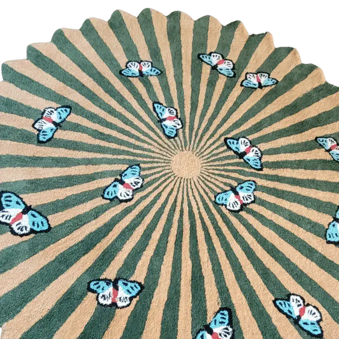 A beautifully designed round wool rug featuring an earthy color palette with striking butterfly patterns over a flower-like radial design. Ideal for enhancing the aesthetics of living rooms and dining rooms, this hand-tufted area rug adds a touch of elegance and nature-inspired charm to any space.