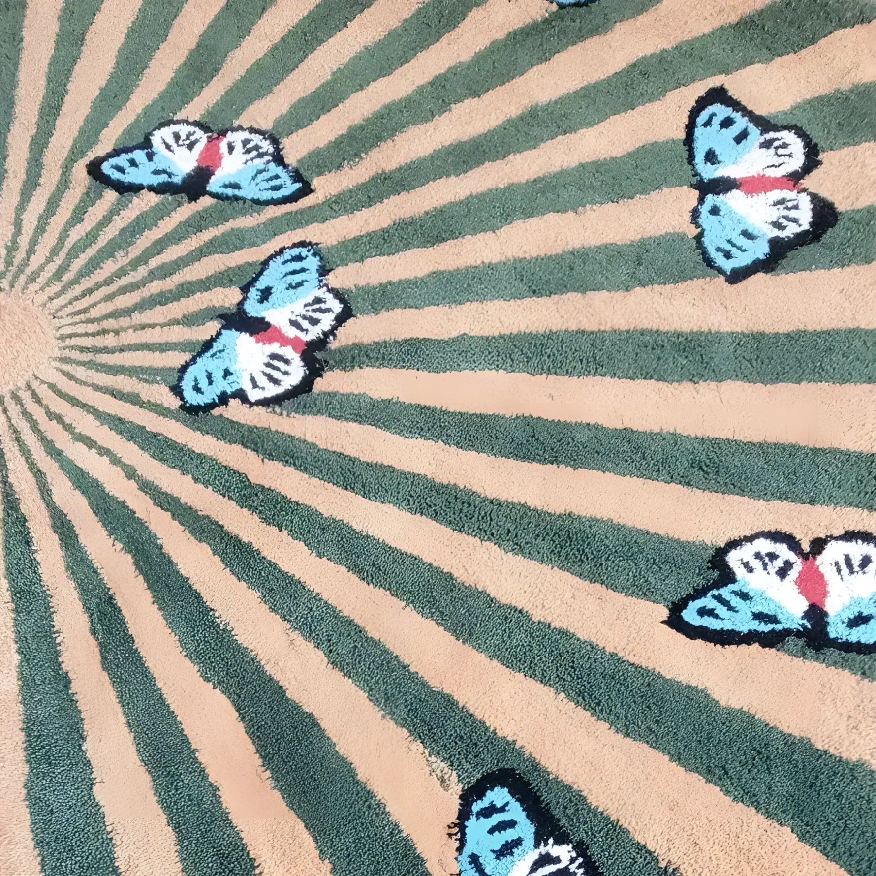 A beautifully crafted hand-tufted wool area rug featuring a vibrant design of butterflies over a radiating pattern. Perfect for adding a touch of elegance to living room and dining room spaces, this round rug showcases earthy tones, making it an ideal centerpiece for your living room area. The detailed butterfly motif enhances the natural charm of this dining room wool rug.