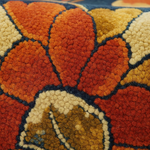 Close-up of a textured rug with autumnal colors