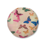 Round Butterfly Kisses Dreamy Pink Flight Floor Pillow with scattered colorful butterflies in pink, blue, teal and gold on a soft cream-pink background