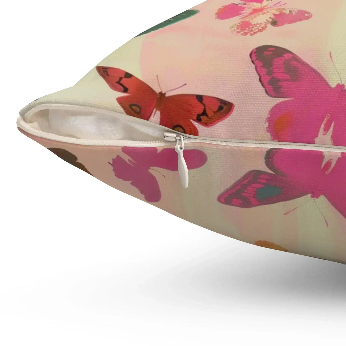 Butterfly Kisses Dreamy Pink Flight Throw Pillow close-up zipper detail showing white zipper with large pink and red butterfly motifs