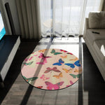 round butterfly rug on dark wood floor with dramatic window light casting shadows across colorful butterfly pattern