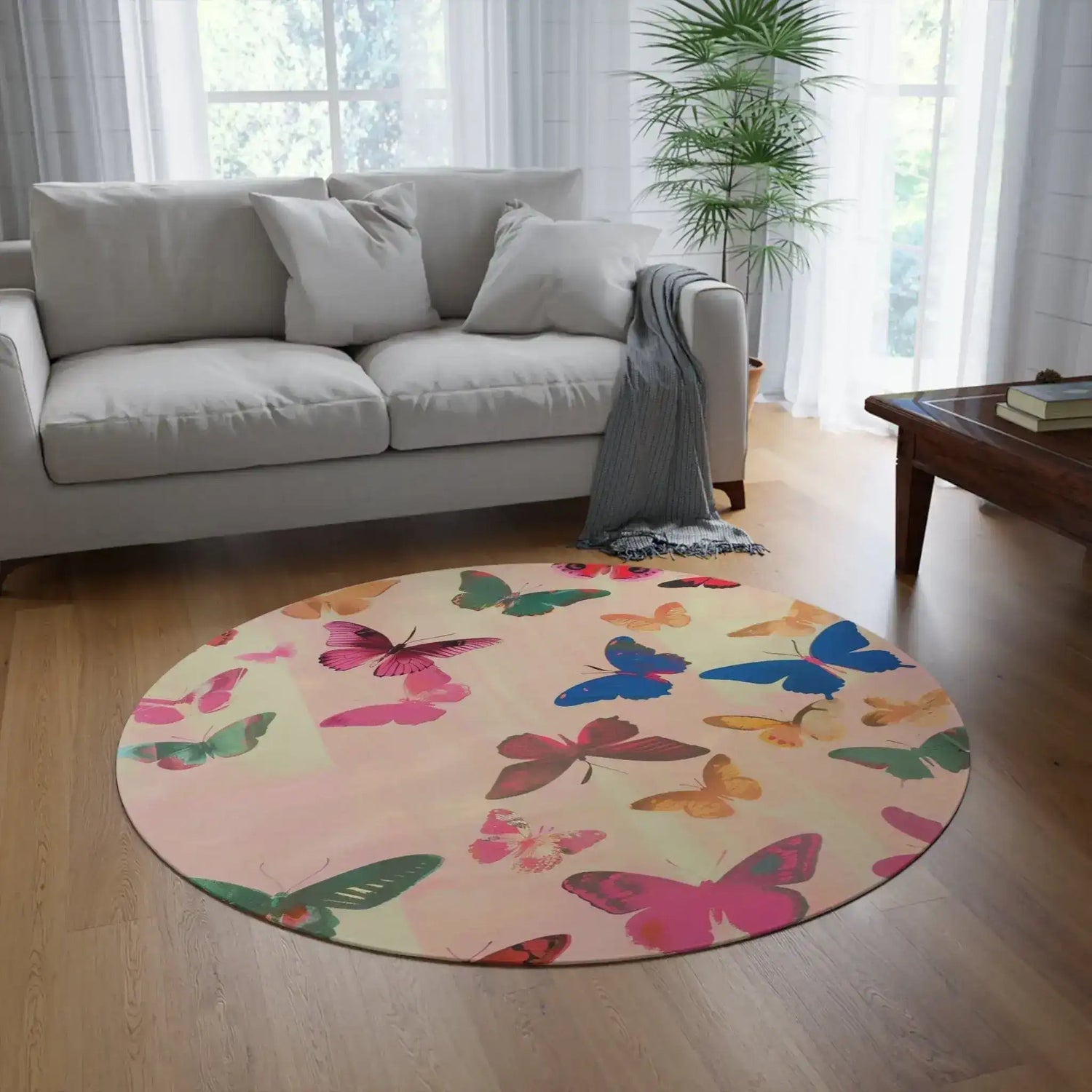 round butterfly rug on light hardwood floor with colorful pink blue green gold butterflies in room setting