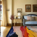 calming colors hand knotted wool rug with navy blue red rose and golden brushstroke bands in traditional bedroom