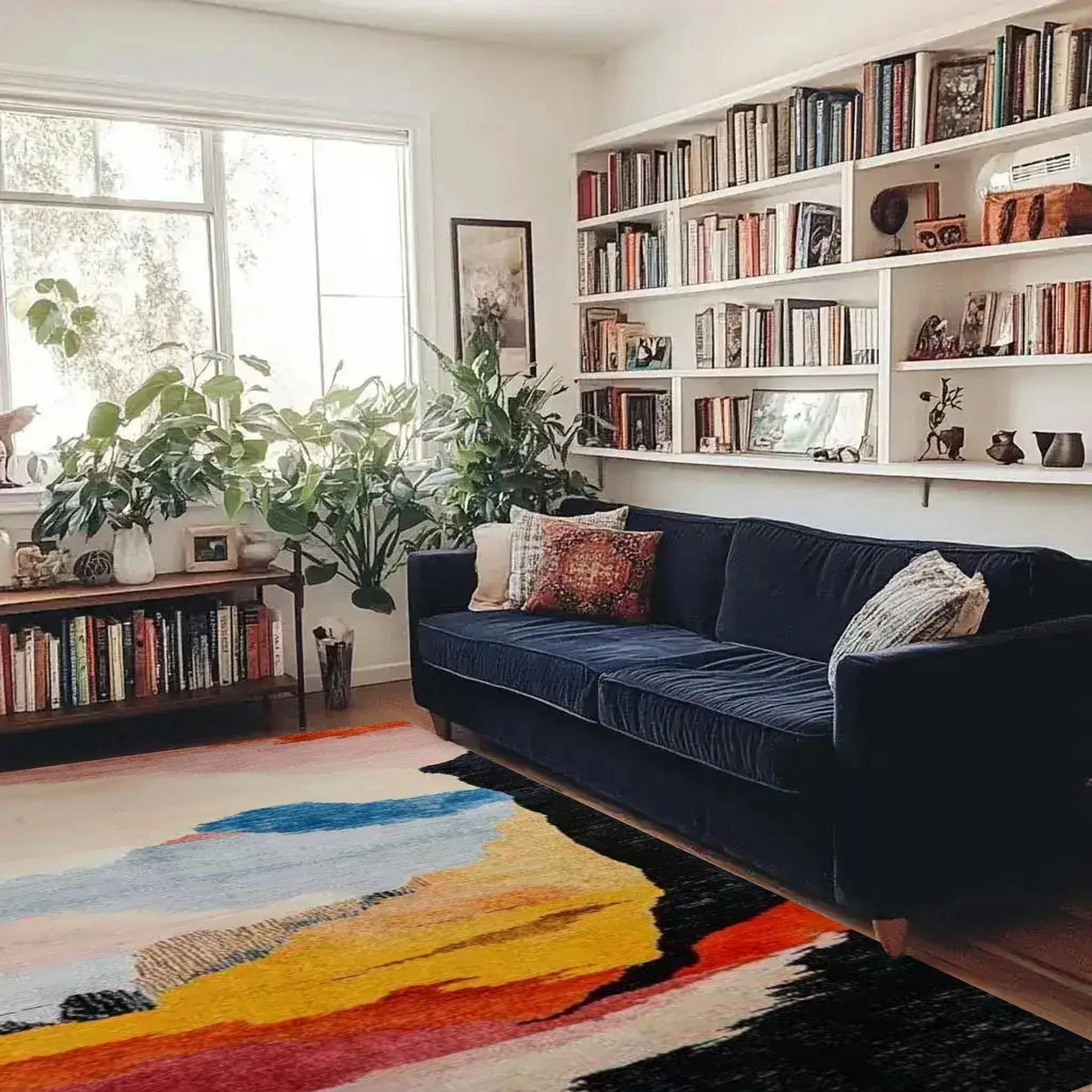 calming colors hand knotted wool rug with abstract color blocks in cream blue yellow orange black under navy sofa