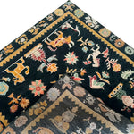 Close-up view of a Cambodian Heritage Wool Hand Knotted Area Rug, showcasing intricate animal and floral motifs in vibrant colors. This wool rug is perfect for adding a touch of elegance to any bedroom or living room. The square area rug features a rich, detailed border, making it an ideal choice for those seeking unique bedroom rugs or bedroom area rugs.