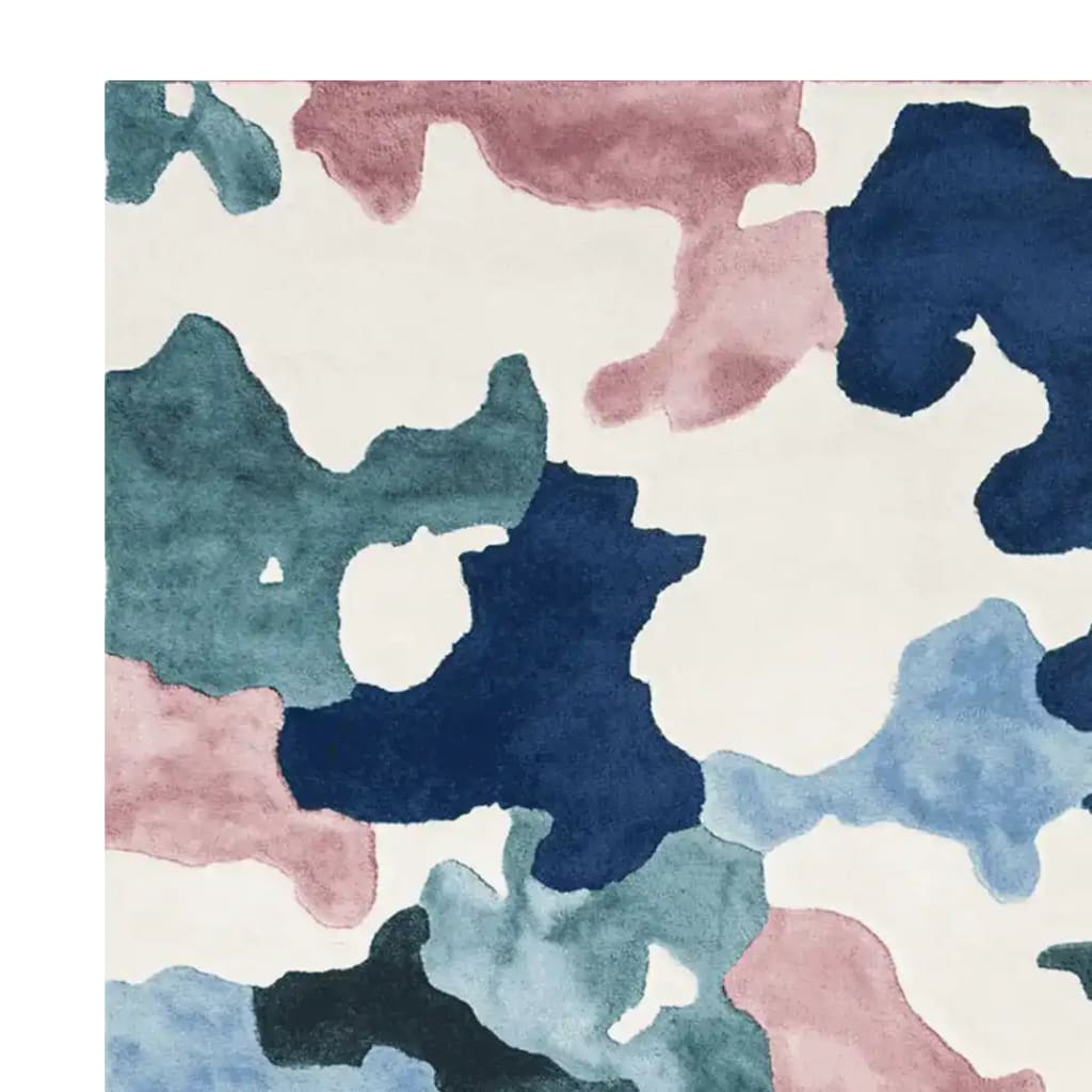 Top view of the Camouflage Cloud Dance Hand Tufted Rug, showcasing a vibrant abstract pattern with shades of blue, pink, and cream. This wool area rug is perfect for contemporary living rooms, adding a modern touch to large spaces.