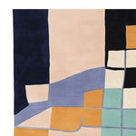 This vibrant area rug features a contemporary abstract design with bold colors and geometric shapes, perfect for enhancing any living room. Made from high-quality wool, this hand tufted rug combines navy, beige, orange, and teal segments, offering a modern touch to large living room spaces.