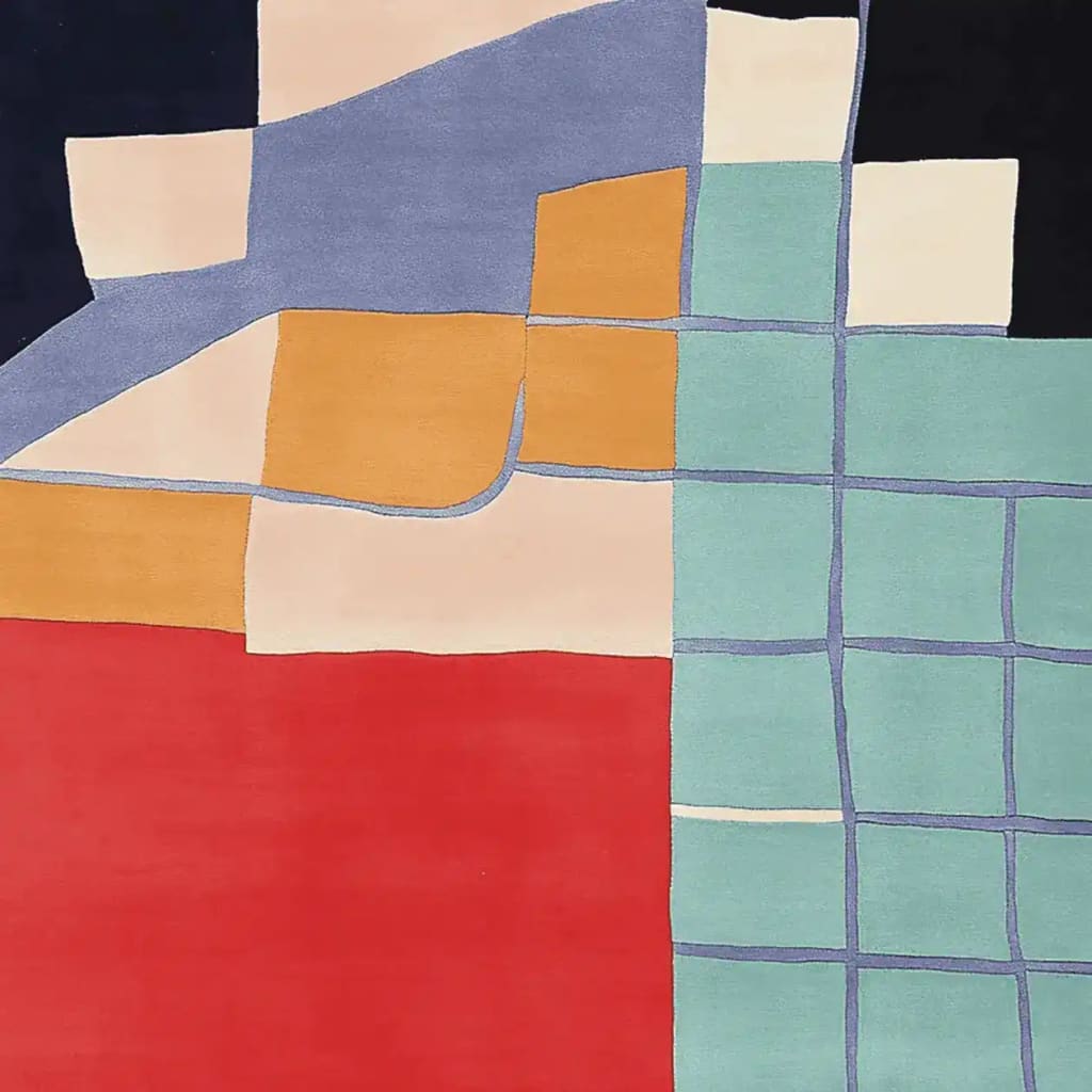 Top view of a hand tufted wool rug with an abstract design featuring bold blocks of red, blue, and green. This contemporary rug is perfect for large living room spaces, adding a modern touch to your decor.